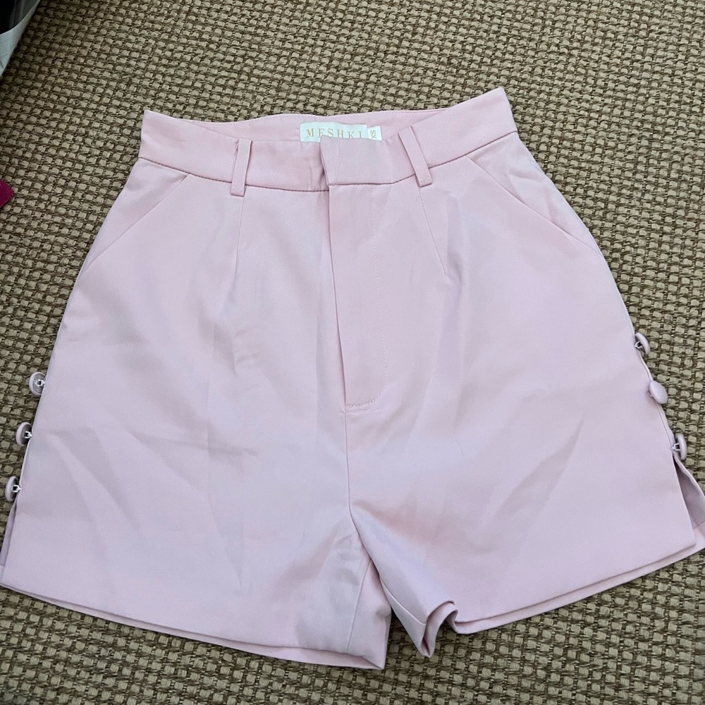 Meshki pink high waisted shorts with button details on the side